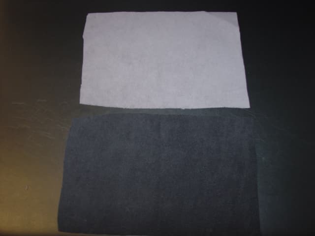 A TRILAMINATE FABRIC COMPRISING OF A LAYER OF A WEFT KNIT, DYED, BRUSHED FABRIC, 100 PERCENT POLYESTER BONDED TO A WOVEN, DYED FABRIC, 84 PERCENT NYLON, 16 PERCENT ELASTANE. EXCEEDS 30CM IN WIDTH.THE ADHESIVE CANNOT BE SEEN IN CROSS SECTION.