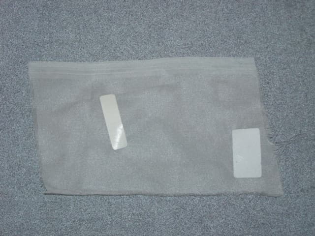 WOVEN VOILE POLYESTER FABRIC, OF POLYESTER FILAMENTS OF HIGH TENACITY YARN. DYED WHITE. TO BE MADE INTO NET CURTAINS.