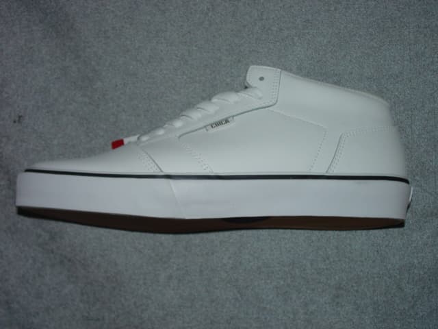 SKATEBOARDING SHOE FOR MEN. COVERING THE ANKLE, BUT NO PART OF THE CALF. UPPERS OF LEATHER. OUTER SOLES OF RUBBER WITH RIDGED TREAD PATTERN DESIGNED FOR IMPROIVED SKATEBOARD GRIP. WITH SPECIAL TECHNOLOGY FEATURE IN THE FORM OF A SHOCK ABSORBING CUSHIONING PAD DESIGNED TO ABSORB IMPACT. INSOLE LENGTH MORE THAN 24CMS. WITH LOGO ON TONGUE, SIDE, HEEL AND OUTER SOLE. LACE UPS. CIF PRICE MORE THAN 7.5 EURO.  WHITE IN COLOUR.