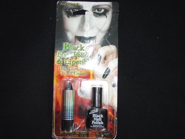 A SET COMPRISING OF BLACK NAIL VARNISH AND BLACK LIPSTICK. PACKAGED IN A BLISTER PACK ON A PRINTED HANGING CARD.