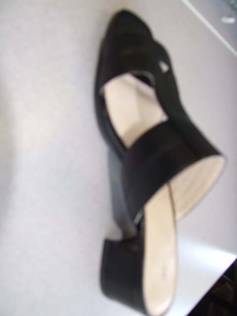 LADIES SANDAL WITH UPPERS OF PLASTIC. OPEN TOE WITH OPEN SIDES ON THE VAMP.  WITH A SOLE AND HEEL OF COMBINED HEIGHT OF MORE THAN 3 CMS.  THE SOLE IS OF RUBBER ON THE HEEL WITH A RUBBER AND TEXTILE SOLE.  THE TEXTILE DURABLE SOLE PROVIDES THE GREATEST SURFACE AREA IN TOUCH WITH THE GROUND.  THE TEXTILE SOLE IS OF DURABLE QUALITY.