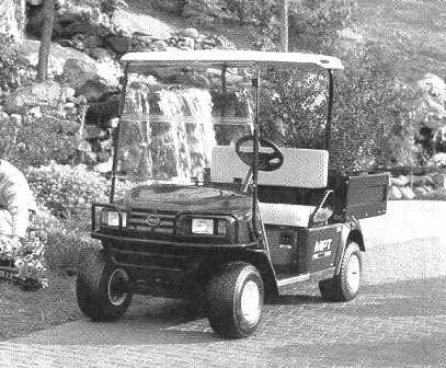 PETROL DRIVEN LIGHT-WEIGHT UTILITY TRUCK TO TACKLE THE TOUGHEST JOBS AROUND YOUR WORK AREA.  FRAME: WELDED STEEL WITH POWDER COAT FINISH.  FRONT BODY AND FINISH: INJECTION MOULDED.  REAR BODY AND FINISH: STEEL, BASE COAT/CLEAR COAT.  STANDARD COLOUR: FOREST GREEN.  POWER SOURCE: 401 CC PETROL ENGINE.  HORSEPOWER: 13 HP.  SEATING CAPACITY: 2 PERSONS.  DRY WEIGHT (WITHOUT BATTERIES): 336 KG.  OVERALL LENGTH: 2616 MM.  OVERALL WIDTH: 1181 MM.  OVERALL HEIGHT: 1727 MM (WITH CANOPY), 1234MM (TO TOP OF STEERING WHEEL).  WHEEL BASE: 1664 MM.
