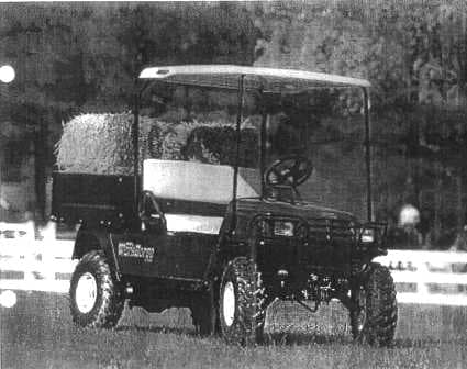 PETROL DRIVEN UTILITY VEHICLE WHICH IS A PERFECT COUNTRYSIDE WORKHORSE FOR RUGGED TERRAIN.  FRAME: WELDED STEEL WITH POWDER COATED FINISH.  FRONT BODY AND FINISH: INJECTION MOULDED.  REAR BODY AND FINISH: STEEL WITH BASE COAT/CLEAR COAT.  STANDARD COLOUR: FOREST GREEN.  POWER SOURCE: 401 CC PETROL ENGINE.  HORSEPOWER: 13 HP.  SEATING CAPACITY: 2 PERSONS.  DRY WEIGHT (WITHOUT BATTERIES): 408 KG.  OVERALL LENGTH: 2832 MM.  OVERALL WIDTH: 1260 MM.  OVERALL HEIGHT: 1854 MM (WITH CANOPY), 1257 MM (TO TOP OF STEERING WHEEL).  WHEEL BASE: 1960 MM.