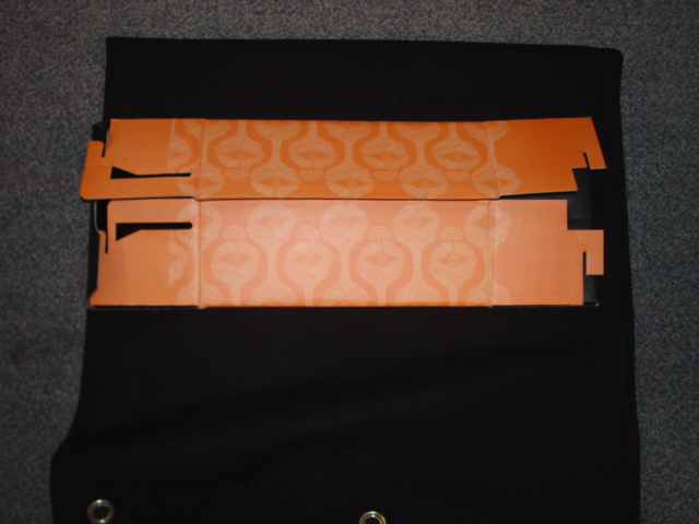 FOLDING PRINTED CORRUGATED CARDBOARD BOX ORANGE AND BLACK IN COLOUR WITH A FOLDING PRINTED CORRUGATED CARDBOARD SLEEVE GREY AND ORANGE IN COLOUR. DESIGNED FOR THE PACKAGING OF FOOTWEAR. BOX MEASUREMENTS LENGTH 330MM X WIDTH 217MM X DEPTH 125MM APPROXIMATELY. SLEEVE MEASUREMENTS LENGTH 335MM X WIDTH 228MM X DEPTH 128MM APPROXIMATELY.
