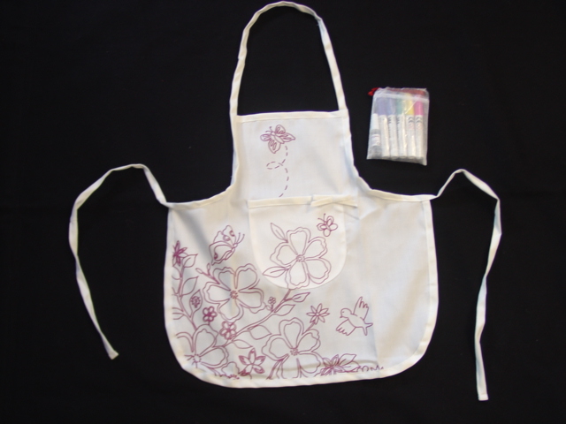 CRAFTWORK SET FOR DECORATING YOUR OWN APRON CONSISTING OF 1X WOVEN POLY COTTON DRILL CHILDREN'S APRON 5X PERMANENT TEXTILE MARKER PENS 1X PACK OF SEQUINS 1X TUBE OF GLUE. PACKAGED IN A CLEAR PLASTIC BAG WITH A PRINTED CARDBOARD INSERT AND A SET OF INSTRUCTIONS.