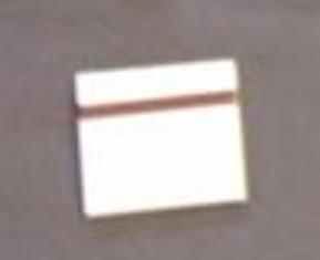 A PACK OF MATCHES WITH CARDBOARD STEMS, PRESENTED IN A WHITE CARDBOARD BOX WITH A STRIKING STRIP ON THE BACK.  THE MATCHES ARE PART OF A FESTIVAL SURVIVAL KIT. THE OTHER ITEMS ARE CLASSIFIED SEPARATELY.