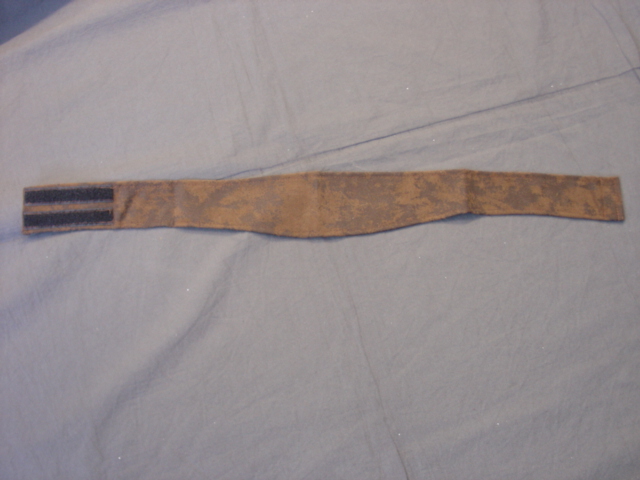 A KNITTED BELT OF MAN-MADE FIBRES WITH VELCRO FASTENING AT THE BACK. PACKAGED TOGETHER FOR RETAIL SALE WITH A CHILD'S FANCY DRESS COWGIRL OUTFIT. ALL ITEMS CLASSIFIED SEPARATELY.