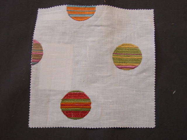 A WOVEN FABRIC WITH EMBROIDERED CIRCULAR DESIGN. OF 77 PERCENT LINEN AND 23 PERCENT VISCOSE. WITH VISIBLE BACKGROUND OF 100 PERCENT LINEN. OF A VALUE EXCEEDING 17.50 EURO PER KG. WIDTH 137 CMS.