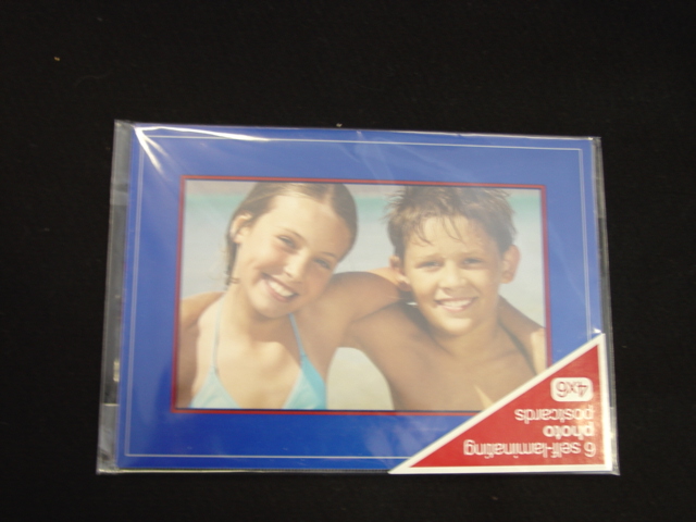 PRINTED POSTCARDS WITH SPACE FOR WRITTEN MEESAGE AND ADDRESS LINED.  THE PHOTO POSTCARD ENABLES THE SENDER TO PUT A PERSONAL PHOTO ON THE FRONT WHICH IS SEALED IN BY ADHESIVE LAMINATE.