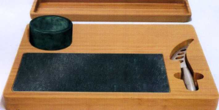 A CHEESE BOARD AND KNIFE SET. THE SET COMPRISES OF A BAMBOO BOARD WITH A MARBLE BOARD INSET. THE BOARD ALSO HAS A SPACE FOR THE KNIFE TO FIT IN. THE KNIFE IS MADE OF STAINLESS STEEL WITH A FIXED BLADE WHICH IS ROUNDED TO FACILITATE CUTTING THE CHEESE. THERE IS ALSO A NARROW TRAY AND A SMALL MARBLE BOWL WHICH IS DETACHABLE FROM THE BOARD. PACKAGED TOGETHER FOR RETAIL SALE.