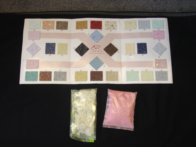 TEXTILE FLOCK CONTAINING 50 PER CENT WOOL AND 50 PER CENT COTTON.  THE FLOCK IS DYED AND CONTAINS AN ADHESIVE WHICH WHEN MIXED WITH WATER PRODUCES A WALL COVERING WHICH CAN BE USED ON ANY FLAT SURFACE INCLUDING WALLS, WOOD AND TILES ETC. THE WALL COVERING DOES NOT REQUIRE PAINTING AS THE COLOUR IS PRODUCED BY THE DYED TEXTILE FLOCK.  THE TEXTILE FLOCK CONTAINS TEXTILE FIBRES LESS THAN 5MM IN LENGTH.