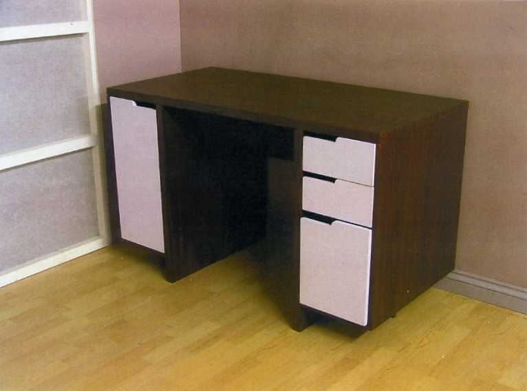OFFICE FURNITURE COMPRISING A PI OFFICE DESK MADE OF WALNUT WOOD WITH WHITE FOILED DOOR FRONTS. PACKAGED FOR RETAIL SALE IN A BROWN CARDBOARD BOX. MEASUREMENTS 75.5CMH X 59.00W. TWO SMALL DRAWERS AND PEDESTAL.