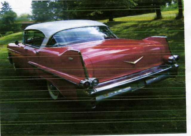 USED1957 CADILLAC SEDAN  DE  VILLE WITH A SPARK IGNITION INTERNAL COMBUSTION RECIPROCATING PISTON ENGINE HAVING A CYLINDER CAPACITY OF 6 LITRES. VIN NO 5762137077. THIS CAR HAS RED PAINTWORK WITH A WHITE ROOF. THE ENGINE IS A  PETROL V8 WITH AN AUTOMATIC GEARBOX.