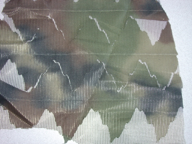 WOVEN POLYESTER FABRIC WITH VISIBLE GROUND.  WITH APPLIQUE  PRINTED WOVEN POLYESTER FABRIC  WITH A  LEAFY CAMOUFLAGE DESIGN. VALUE EXCEEDS 17.50 EURO/KG.