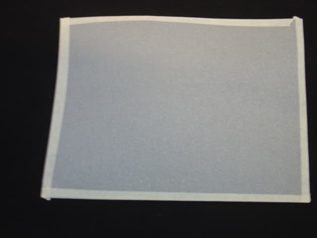 WOVEN FIBRE GLASS FABRIC OF A WEIGHT OF 690 G/M2 . CONTAINING STAINLESS STEEL WIRE COATED ON BOTH SIDES WITH WOVEN POLYURETHANE CONTAINING ALUMINUM POWDER. OF WIDTH RANGING FROM 1M TO 3M.