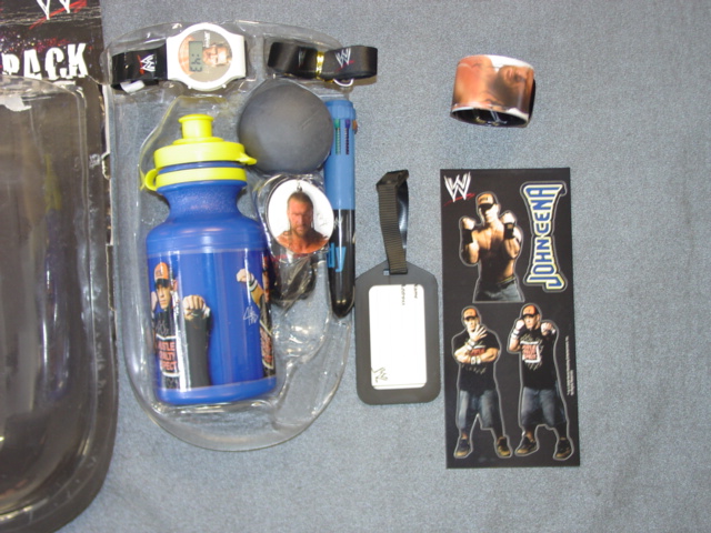 A GEL BALL POINT PEN. WITH 10 MULTICOLOURED INKS (1BLACK, 2REDS, 2PURPLE, 2BROWN, 3GREEN (LIGHT AND DARK), ENCLOSED IN A PLASTIC CASING WITH PICTURE OF A WRESTLER, PART OF A GIFT PACK FOR CHILDREN INCLUDING, PLASTIC WATER BOTTLE, RUBBER BALL, DIGITAL WATCH, PLASTIC BAG ADDRESS TAG, KEYRING, LANYARD, SWEATBAND 
SLAPBAND (A METAL WRIST BAND THAT CHILDREN SLAP ON THEIR WRISTS AND IT WILL WRAP AROUND THE CHILDS WRIST) AND A
STICKER SHEET. WHICH HAVE ALL BEEN CLASSIFIED SEPERATELY. THE CONTENTS ARE HELD IN PLASTIC AND CARDBOARD PACKAGING.
