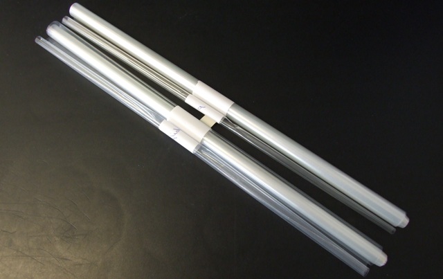 A LAMINATE SHEET MADE FROM POLYMERS OF PROPYLENE OF A THICKNESS NOT EXCEEDING 0.10 MM. DESIGNED FOR SEALING FOIL TRAYS. NOT BIAXIALLY ORIENTED. 55 MICRONS IN TOTAL COMPRISING 43 MICRONS OF ORIENTATED POLYPROPYLENE AND 12 MICRONS OF POLYETHYLENE TEREPHTHALATE