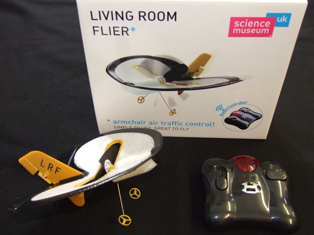 A REMOTE CONTROLLED PLANE OF LIGHTWEIGHT CONSTRUCTION OF POLYSTYRENE AND OTHER PLASTICS. THE PLANE HAS A SINGLE WING ALMOST CIRCULAR IN SHAPE. HAVING ONE PROPELLER MOUNTED IN THE CENTRE OF THE WING POWERED BY A SMALL RECHARGEABLE ELECTRIC MOTOR.  WITH A HAND CONTROLLER POWERED BY 4 AA SIZE BATTERIES.