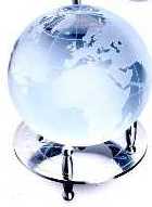 ORNAMENT OF LEAD CRYSTAL GLASS ORB ON A STAINLESS STEEL STAND.  THE GLASS ORB IS ETCHED TO REPRESENT A GLOBE. PACKED IN A CARDBOARD AND PAPER GIFT BOX.
