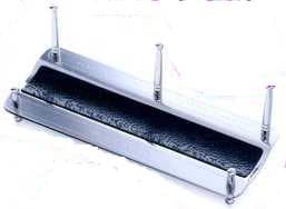 A LETTER RACK MANUFACTURED IN STAINLESS STEEL WITH A LEATHER STRIP ALONG THE LENGTH.  185MM LONG, 76MM WIDE AND 70MM HIGH. PACKED IN A CARDBOARD AND PAPER PRESENTATION BOX.