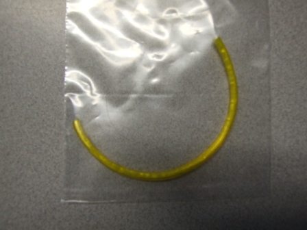 POLYPROPYLENE TEXTILE YARN CORE SHEATHED IN YELLOW COLOURED PLASTIC. APPROXIMATELY 3MM THICK. FOR USE AS A CLOTHES LINE.