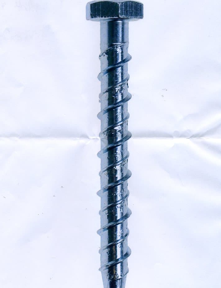 A SPECIALLY HARDENED CONCRETE ANCHOR MADE FROM BORON STEEL.  ZINC PLATED AND CLEAR PASSIVATED. WITH HEXAGONAL HEAD.WITH DOUBLE PROFILE THREAD WHICH CUTS ITS OWN THREAD INTO A PRE-FILLED HOLE FOR FIXING INTO CONCRETE, MASONRY, DENSE BLOCKS AND NATURAL STONE. ROLLED FROM ROUND WIRE. MEASURES APPROXIMATELY 10.5 CM LENGTH 7MM SHANK THICKNESS. OF MORE THAN 800 MPA. THEY ARE USED FOR ANCHORING FIXTURES TO CONCRETE ETC. AND CAN BE REMOVED.
