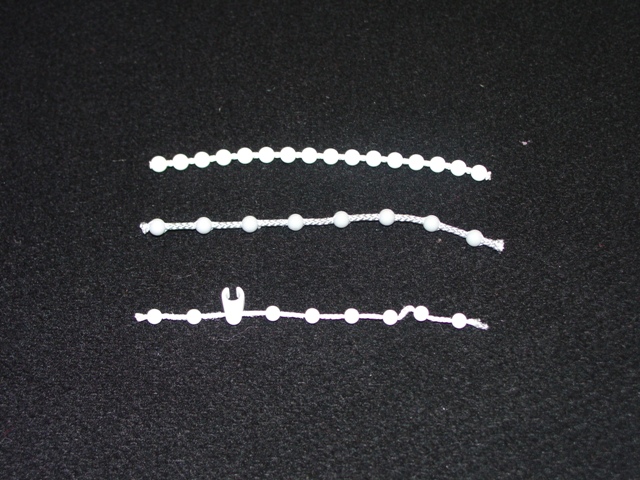 THE PRODUCT IS A CHAIN COMPRISING OF POLYTHENE BEADS FORMED AROUND A TWISTED NYLON CORD. IT IS USED AS AN OPERATING CHAIN FOR WINDOW BLINDS.