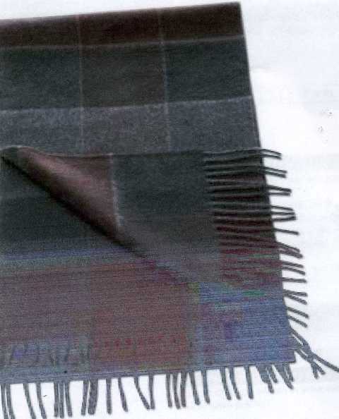 WOVEN SCARF. MADE FROM 100 PERCENT CASHMERE.WITH BLACK AND GREY TARTAN PATTERN. WITH TASSELED ENDS.MEASUREMENTS APPROX 25CM X 180CM.PACKAGED IN A PAPER AND CARDBOARD PRESENTATION BOX..