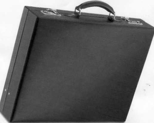 A COMPACT ATTACHE CASE MADE OF LEATHER WITH A PIGSKIN LINING. THE CASE HAS ONE POCKET AND TWO LOCKS. BLACK IN COLOUR. MEASUREMENTS ARE APPROX L465 X H370 X W80MM.