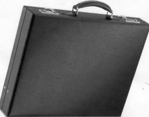 AN ATTACHE CASE MADE OF LEATHER WITH A PIGSKIN LINING. BLACK IN COLOUR WITH A POCKET AND TWO LOCKS. CARRYING HANDLE. MEASUREMENTS ARE L465 XH370 X W100MM.