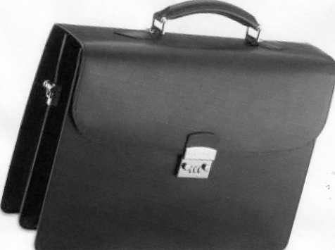 A TWO POCKET BRIEFCASE MADE OF LEATHER WITH PIGSKIN LINING, A LOCK AND A CARRYING HANDLE. MEASUREMENTS ARE APPROX L420MM X H300MM X W110MM. BROWN IN COLOUR. NO BUCKLE FASTENINGS.