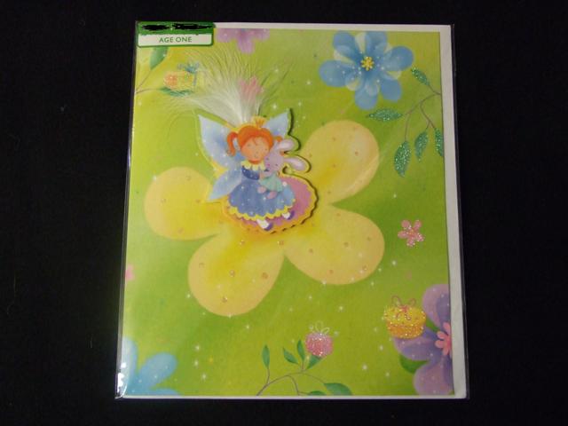 PRINTED PAPERBOARD BIRTHDAY CARD. WITH PRINTED RAISED  PICTURE ON CENTRE FRONT OF CARD. DECORATED WITH GLITTER AND A FEATHER.WITH PRINTED GREETING INSIDE BEARING THE WORDS HAPPY 1ST BIRTHDAY. WITH ENVELOPE. PACKAGED FOR RETAIL SALE IN A PLASTIC ENVELOPE WITH PRINTED LABEL.
