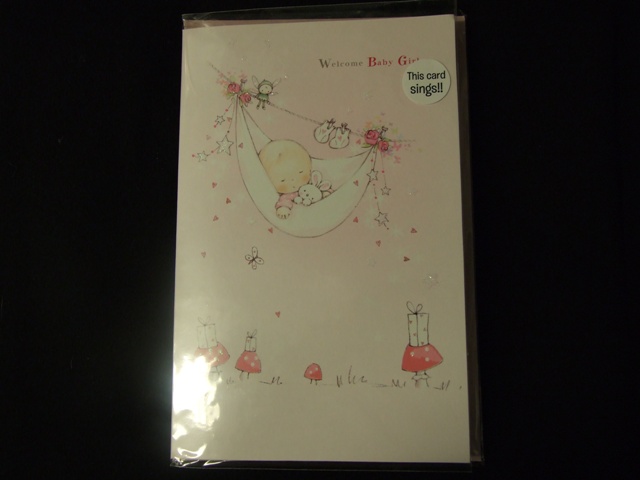 PRINTED PAPERBOARD MUSICAL NEW BABY CARD. WITH PRINTED  PICTURE ON FRONT OF CARD. DECORATED WITH GLITTER.WITH PRINTED GREETING ON FRONT OF CARD AND PRINTED MESSAGE INSIDE.WHEN THE CARD IS OPENED A MUSICAL LULLABY IS PLAYED.WITH ENVELOPE. PACKAGED FOR RETAIL SALE IN A PLASTIC ENVELOPE WITH PRINTED LABEL.