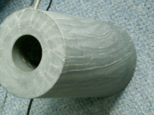 A TUBE OF MAJORITY CURED EPOXY VINYLESTER POLYMER AND POLYESTER FIBRE WHICH IS IMPORTED AS AN UNFINISHED ITEM WHICH IS THEN MACHINED TO SIZE. SPECIFICALLY DEVELOPED FOR A MECHANICAL SYSTEM COMPRISING OF THREE COMPONENTS FOR THE PROTECTION OF MARINE DRIVES FROM THE EFFECTS OF ROPE OR DEBRIS BEING CAUGHT BY A PROPELLER WHILST IT IS BEING DRIVEN BY AN ENGINE.