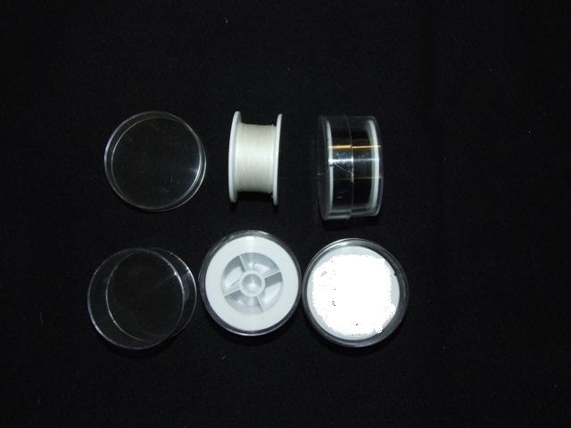 BRAIDED SILK YARN SUTURES COATED WITH WAX. SUPPLIED ON A PLASTIC REEL PACKAGED IN A CLEAR PLASTIC CASE WITH PRINTED LABEL.