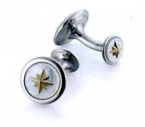 A PAIR OF CUFFLINKS. OF STAINLESS STEEL WITH  MOTHER OF PEARL STONE AND NINE CARAT GOLD SNOWFLAKE IN THE CENTRE. ROUND IN SHAPE. SNOWFLAKE DECORATION IS ALSO ON THE BOTTOM PART OF THE CUFFLINKS.  PACKAGED FOR RETAIL SALE IN A PLASTIC AND PAPER GIFT BOX.