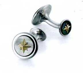 A PAIR OF CUFFLINKS. OF STAINLESS STEEL WITH BLACK MOTHER OF PEARL STONE AND NINE CARAT GOLD SNOWFLAKE IN THE CENTRE. ROUND IN SHAPE. SNOWFLAKE DECORATION IS ALSO ON THE BOTTOM PART OF THE CUFFLINKS.  PACKAGED FOR RETAIL SALE IN A PLASTIC AND PAPER GIFT BOX.
