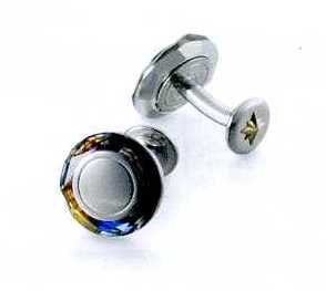 A PAIR OF CUFFLINKS. OF STAINLESS STEEL WITH A  VOLCANO STONE AT THE RIM. WITH NINE CARAT GOLD STAR SHAPE CENTRE ON THE BOTTOM PART OF THE CUFFLINKS. PACKAGED FOR RETAIL SALE IN A PLASTIC AND PAPER GIFT BOX.