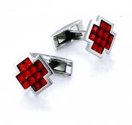 A PAIR OF CUFFLINKS. OF STAINLESS STEEL WITH 12 LIGHT RED FACETED GLASS CRYSTALS. CROSS SHAPED. PACKAGED FOR RETAIL SALE IN A PLASTIC AND PAPER GIFT BOX.
