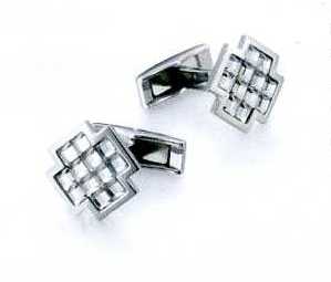 A PAIR OF CUFFLINKS. OF STAINLESS STEEL WITH 12 SILVER SHADE FACETED GLASS CRYSTALS. CROSS SHAPED. PACKAGED FOR RETAIL SALE IN A PLASTIC AND PAPER GIFT BOX.