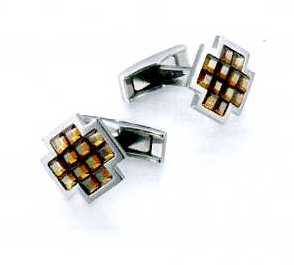 A PAIR OF CUFFLINKS. OF STAINLESS STEEL WITH 12 COPPER FACETED GLASS CRYSTALS. CROSS SHAPED. PACKAGED FOR RETAIL SALE IN A PLASTIC AND PAPER GIFT BOX.