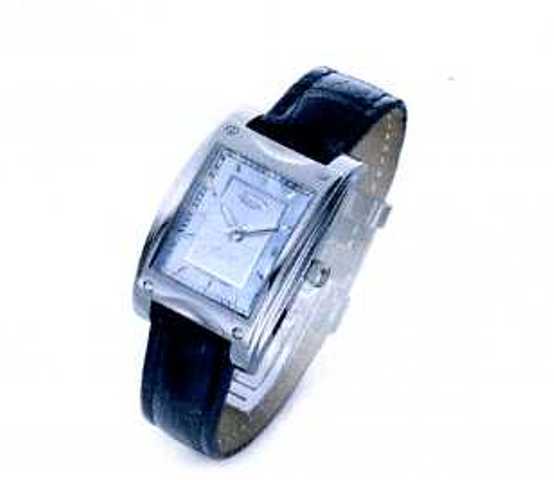 WRIST WATCH WITH SILVER DIAL AND LEATHER STRAP. 25 JEWEL SWISS MADE AUTOMATIC MOVEMENT. DIAL SIZE 30.5MM HIGH X 24MM WIDE. PACKED IN A PLASTIC AND PAPER GIFT BOX.
