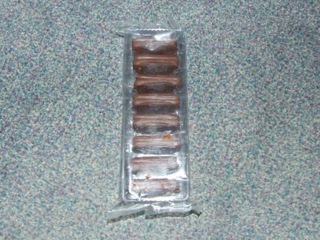 CHOCOLATE COATED, CREME FILLED SANDWICH BISCUIT. BISCUIT TOTALLY COVERED IN DAIRY FREE CHOCOLATE. INGREDIENTS: DAIRY FREE COMPOUND CHOCOLATE (RAW SUGAR, PALM KERNEL OIL, SOY FLOOR, COCOA POWDER, EMULSIFIER (SOY LECITHIN), NATURAL VANILLA FLAVOUR), GLUTEN FREE FLOUR (BESAN, TAPIOCA), SUGAR, VEGETABLE SHORTENING (ANTIOXIDENT: VITAMIN E), COCOA POWDER, GOLDEN SYRUP, FLAVOURS, XANTHAN GUM, RAISING AGENT - SODIUM BICARBONATE, SALT.  PACK SIZE: 8 BISCUITS OF 20 GRAMS EACH, TOTAL WEIGHT 160 GRAMS. BISCUITS ARE PLACED INSIDE A PLASTIC SURROUND, AND THEN WRAPPED IN A LAMINATED METALLISED FOIL FILM.