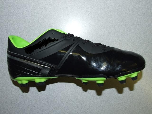 FOOTBALL BOOT. NOT COVERING THE ANKLE.  UPPERS OF PLASTIC. OUTER SOLES OF PLASTIC  WITH 14 MOULDED STUDS. LACE UPS. WITH LOGO ON UPPERS, HEEL AND TONGUE. INSOLE LENGTH MORE THAN 24CMS. BLACK, SILVER AND LIME IN COLOUR.