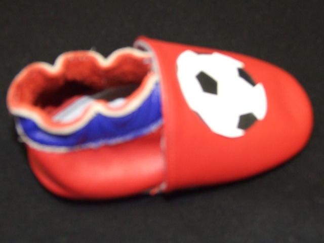 BABIES/INFANTS SLIP ON STYLE INDOOR SHOE. NOT COVERING THE ANKLE.  UPPERS OF LEATHER. OUTER SOLES OF LEATHER. ELASTICATED. WITH FOOTBALL DESIGN MOTIF. INSOLE LENGTH LESS 24CMS. RED IN COLOUR.