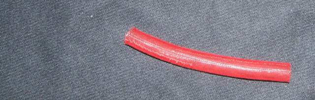 TUBULAR BRAID. OF NYLON. WITH A NON COMPACT STRUCTURE. USED FOR DECORATIVE PURPOSES. MADE ON A BRAIDING MACHINE.