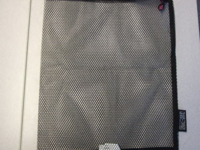 A POLYESTER MESH DRAWSTRING BAG MEASURING 30CM WIDE AND 37CM LONG.
