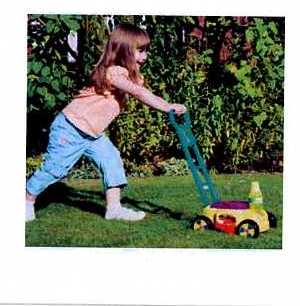 CHILDS TOY PLASTIC LAWNMOWER. WITH 4 WHEELS. WHEN PUSHED ALONG THE TOY BLOWS BUBBLES.