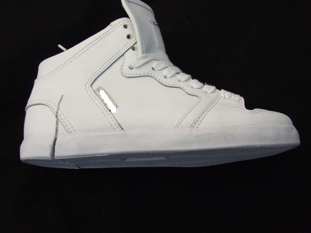 UNISEX  LACE-UP  BASKETBALL SHOE. COVERING THE ANKLE BUT NO PART OF THE CALF.  UPPER OF WHITE LEATHER AND A SOLE OF SYNTHETIC MATERIAL WITH A TREAD PATTERN DESIGNED FOR IMPROVED SKATEBOARD GRIP.  WITH SPECIAL TECHNOLOGY FEATURE IN THE FORM OF A SHOCK ABSORBING CUSHIONING PADS AND EVA MIDSOLE.   IN-SOLE LENGTH LESS THAN 24CM. WITH LOGO ON INSOLE,SIDE,TONGUE AND SOLE. CIF PRICE EXCEEDS EURO 7.5