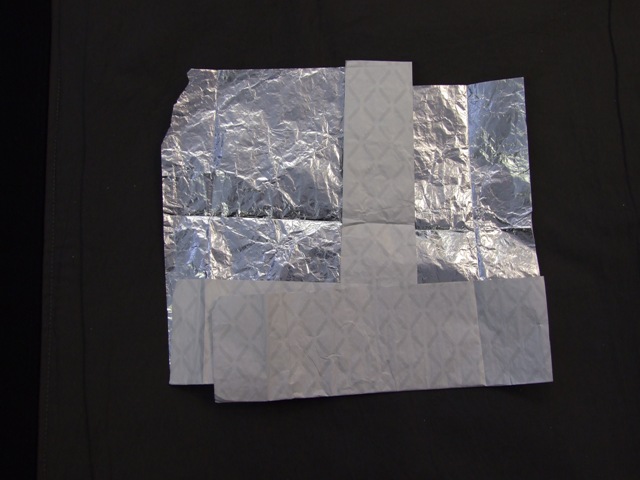 ALUMINIUM FOIL WRAP. BACKED WITH PAPER. THICKNESS OF FOIL, WITH BACKING: 0.0455 MM. THICKNESS OF FOIL, EXCLUDING BACKING: 0.00991MM. IN RECTANGULAR SHEETS. LENGTH OF SHEET: 33.02 MM (13 INCHES). WIDTH OF SHEET: 25.40 MM (10 INCHES). WEIGHT OF INDIVIDUAL SHEET: 3.43 GRAMS. USED TO WRAP HOT DOGS.